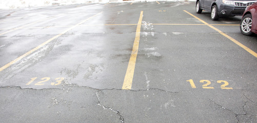 empty parking spaces with numbers © Rusty