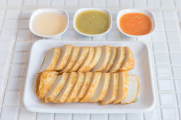 Fried fish bar in white plate,street food.