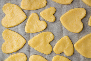 The process of of preparing gingerbread hearts on Valentine's Day. top view