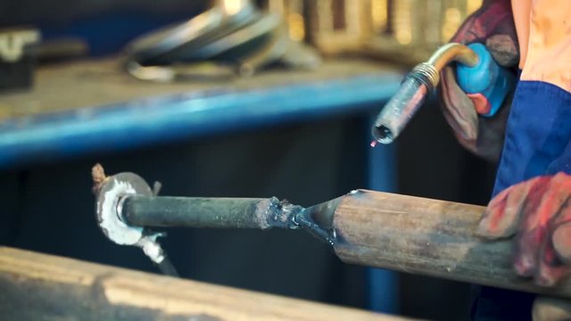 Welding with wire welding : Industrial welder, steel beam, light and sparks. Metal Welding Worker Welding Metal