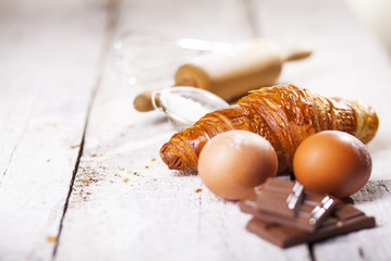 Croissants and ingredients for the preparation of bakery products.