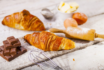 Croissants and ingredients for the preparation of bakery products.