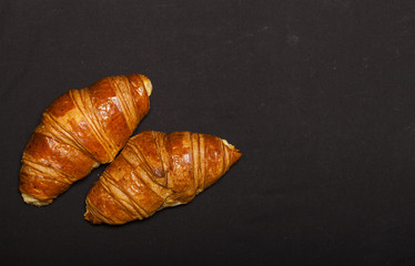 Croissants on black background