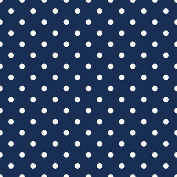 White polka dots on navy blue background