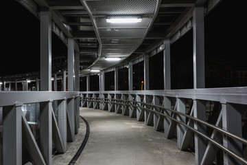 Overhead pedestrian bridge at night in Burgas, Bulgaria © d_zheleva