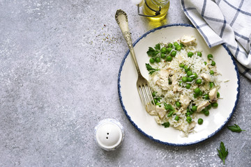Rice with chicken and green peas.Top view with copy space.