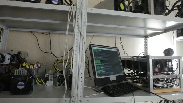 computer screen showing information about cryptocurrency in mining farm.