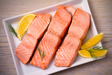 Steamed salmon fish fillet on white plate. Clean eating, healthy and diet food concept