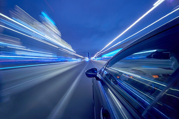 View from Side of Car moving in a night city