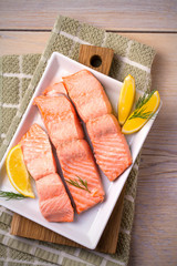 Steamed salmon fish fillet on white plate. Clean eating, healthy and diet food concept