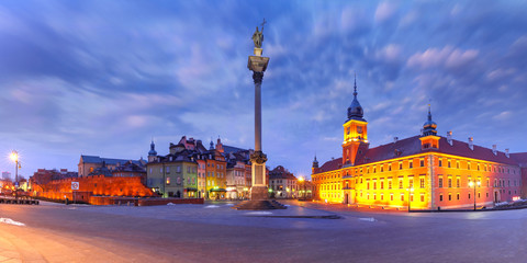 Fototapeta na wymiar Panorama of Castle Square with Royal Castle, colorful houses and Sigismund Column called Kolumna Zygmunta in Old town during morning blue hour, Warsaw, Poland.
