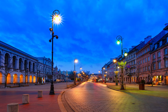 Krakowskie Przedmiescie street, part of the Royal Route in Old Town during evening blue hour, Warsaw, Poland.