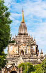 View of the facade of the building of the Shwegugyi temple in Bagan, Myanmar. Copy space for text. Vertical.