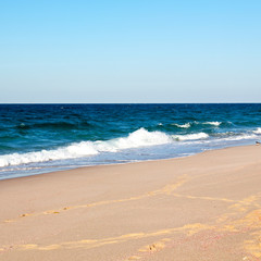 Fototapeta na wymiar in oman coastline sea ocean gulf rock and beach relax near sky