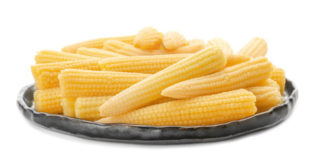 Plate with fresh young baby corn on white background
