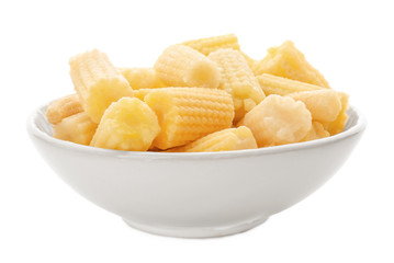Bowl with cut young baby corn on white background