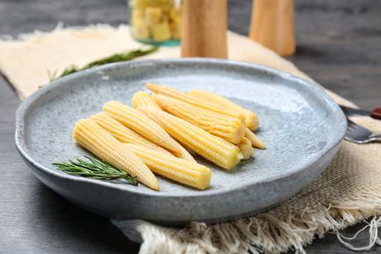 Fresh young baby corn on plate