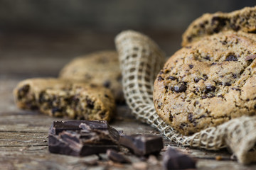 Freshly Baked Chocolate Cookies on Rustic Wooden Table. Sweet Biscuits. Homemade pastry.