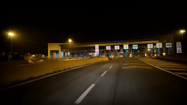 Toll road terminal in Frnace. Night. Barriers.