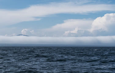 Extremely long barrel cloud covers the coast