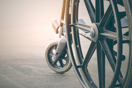 close up view of  wheelchair with Pavement handicap symbol