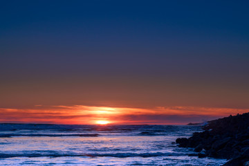 Ocean Sunset Along The Jetty