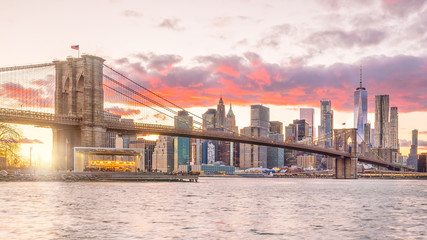 Beautiful sunset over brooklyn bridge in New York City