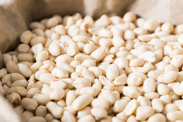 Image of white peanut in container