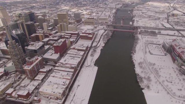 Nashville Snow- Over river pan to city buildings