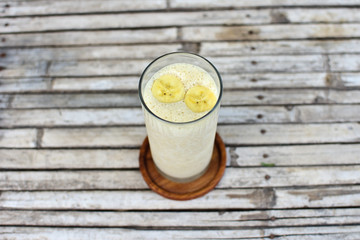 Homemade useful Banana Smoothie in glass for healthy breakfast
