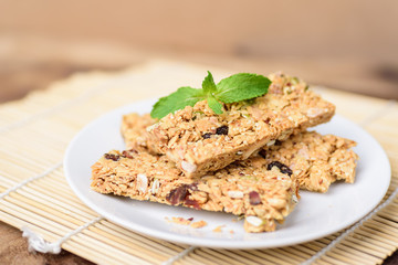Snack bar or energy bar on white dish