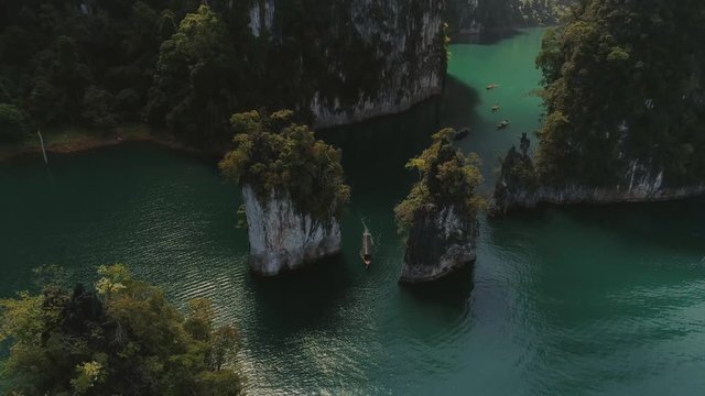 Tropical Thai jungle lake Cheo lan drone flight, wild mountains nature national park