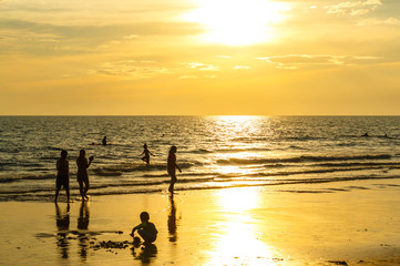 Sandy beach, golden sea, sunset