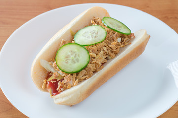 Copenhagen hot-dog on white plate.