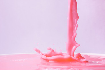 Splash of strawberry milk from the glass