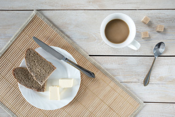 A woman having a breakfast at a table