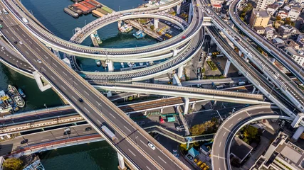 Foto op Plexiglas Osaka Expressway top view, Top view over the highway, expressway and motorway, Aerial view interchange of Osaka City, Expressway is an important infrastructure in Osaka City, Japan. © Kalyakan