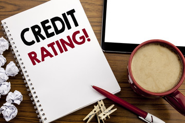 Conceptual hand writing text caption inspiration showing Credit Rating. Business concept for Finance Score History written on notepad note paper on the wood table with coffee in office