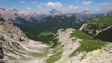 AERIAL VIEW: flight over Dolomiti , Italian National Park Tre Cime Di Lavaredo camera moving forvards .