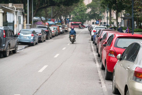 Cars parked on the urban street side