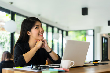 young businesswoman working with mobile laptop and documentsin office, business concept