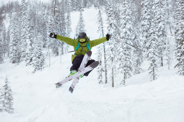 Fototapeta na wymiar Skier jumps offpiste ski slope resort