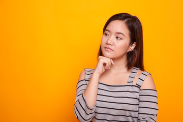 Serious  young Asian woman  look away.