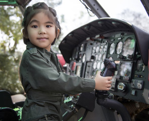 asian girl hanging helicopter control to catch up her dream