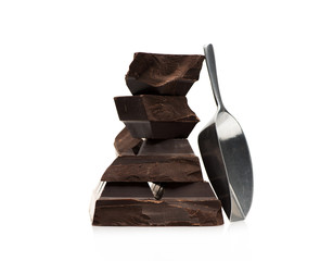 Block and pieces chocolate on a white background