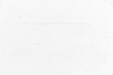 Fototapeta premium White ragged, rough wall concrete background.