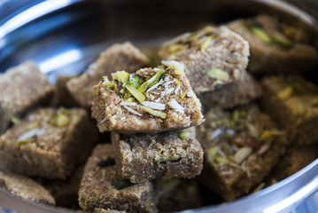 Mohanthal (sweetened gram flour fudges made with Ghee, and flavored with saffron and almonds) a Traditional Gujarati Sweet in Rajkot, Gujarat, India