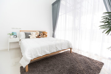 Empty white room interior with bed,
