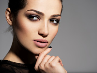 Face of a beautiful girl with smoky eyes makeup