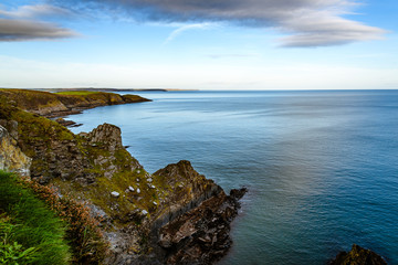 Scenic view of cliffs in Irish coast at sunset.